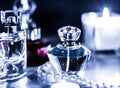 Perfume bottle and vintage fragrance on glamour vanity table at night, pearls jewellery and eau de parfum as holiday gift, luxury Royalty Free Stock Photo