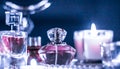 Perfume bottle and vintage fragrance on glamour vanity table at night, pearls jewellery and eau de parfum as holiday gift, luxury Royalty Free Stock Photo