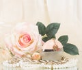 Perfume bottle, white rose and pearls beads Royalty Free Stock Photo