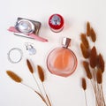 Perfume bottles and brown herbs Lagurus. Flatlay, top view, lifestyle