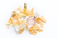 Perfume bottles with flower petals on light background. Perfumery, fragrance collection. Women accessories. Royalty Free Stock Photo