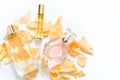 Perfume bottles with flower petals on light background. Perfumery, fragrance collection. Women accessories. Royalty Free Stock Photo