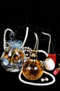 Perfume bottles and jewellery. Royalty Free Stock Photo
