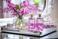 perfume bottles on a mirrored tray with fresh flowers Royalty Free Stock Photo