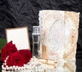Perfume bottles, roses and with wedding rings Royalty Free Stock Photo