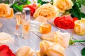 Perfume bottles with roses Royalty Free Stock Photo