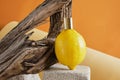 perfume with lemon scent concept, lemon with a spray of perfume on a concrete podium Royalty Free Stock Photo