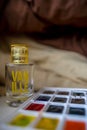 Perfume with pallets on the black being coverlet