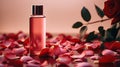 Perfume with scent of roses. Concept of tenderness and femininity. Pink glass perfume bottle. Royalty Free Stock Photo