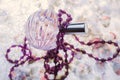 Perfume and string of pearls Royalty Free Stock Photo