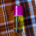 Perfume on a two-tone plaid background Royalty Free Stock Photo