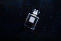 Perfume on a wet background Royalty Free Stock Photo