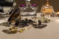 Perfumes and jewelry arranged on a flat surface with a jewelry box in the background