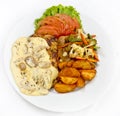 Peri peri Chicken with Button mushroom gravy, Saute Vegetables, Spicy fried Potatoes with Tomato Lettuce Salad Royalty Free Stock Photo