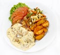 Peri peri Chicken with Button mushroom gravy, Saute Vegetables, Spicy fried Potatoes with Tomato Lettuce Salad Royalty Free Stock Photo