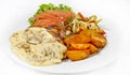 Peri peri Chicken with Button mushroom gravy, Saute Vegetables, Spicy fried Potatoes with Tomato Lettuce Salad Royalty Free Stock Photo