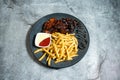 Peri Peri chicken with french fries served in plate isolated on background top view of baked food indian dessert Royalty Free Stock Photo