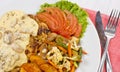 Peri peri Chicken with Button mushroom gravy, Saute Vegetables, Spicy fried Potatoes with Tomato Lettuce Salad Royalty Free Stock Photo