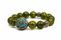 Peridot bracelet Beads green ore lucky stone decorate whit Chakra amulet Royalty Free Stock Photo