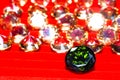 Peridot green diamond on red background