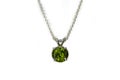 Peridot pendant, silver chain. White background.