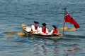 Period actors in rowboat, Colonial times