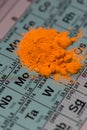 Periodic system table with orange powder element