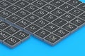 Periodic table of elements on blue background. Scientific development Royalty Free Stock Photo