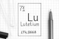 The Periodic table of elements. Handwriting chemical element Lutetium Lu with black pen, test tube and pipette