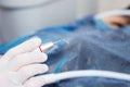 Dental ultrasonic scaler with water splash on black background. Close up. - macro photography