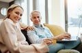 The perks of saving. a mature couple using a credit card and laptop on the sofa at home. Royalty Free Stock Photo