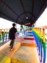 Rainbow bridge in Kuala Perlis. People walking crossing