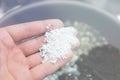 Perlite in the hands of a man. Substrate for marijuana. Close up. Soil growing cannabis. A mixture of earth Royalty Free Stock Photo