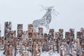 Fragment of a snow-covered art object in the Perm Krai, Russia, in the form of a group of idols depicting anthropomorphic figures