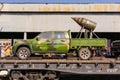 Improvised gun truck of terrorists on a railway flatcar