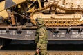 Soldier guarding themobile exhibition of trophies of the Russian army during the Syrian campaign