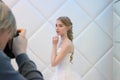 PERM, RUSSIA - FEB 12, 2017: Photographer shoots blonde bride in