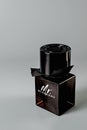 Perm, Russia, February 03 2021: Photo of a dark bottle of Burberry men`s perfume on a gray background. Close up.