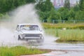 PERM, RUSSIA - JUL 22, 2017: Drifting white car with splash