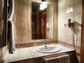 Perm, Russia - July 04, 2023: Modern bathroom interior with stylish mirror, towel and vessel sink
