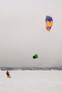 Snow kiter rides on a snowy plain