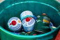 Empty gas cylinders from tourist burners and stoves are thrown into a separate garbage container