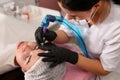 Permanent eyebrow makeup in the beauty salon. Close-up top view. The tattoo master artist makes the procedure sterile