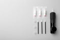 Permanent makeup equipment kit on light grey background, flat lay Royalty Free Stock Photo