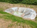 Permanent slope protection with grass using the hydroseed method. The grass is used to stabilize the slope structure and prevent s