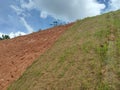 Permanent slope protection using the close turfing method to prevent erosion. Royalty Free Stock Photo