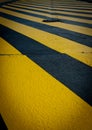 Perpendicular yellow pedestrian crossing Royalty Free Stock Photo