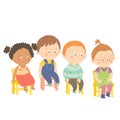 Perplex preschool children sitting on chairs.