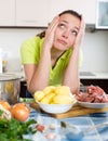 Perplexed woman with meat Royalty Free Stock Photo