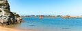 Kayakers paddling along the picturesque red granite coast of northern Birttany